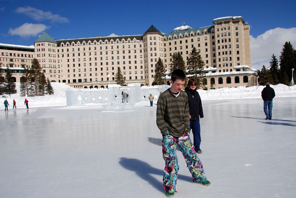 20 Peter Ryan And Charlotte Ryan On Frozen Lake Louise With Ice Castle And Chateau Lake Louise Behind In Winter